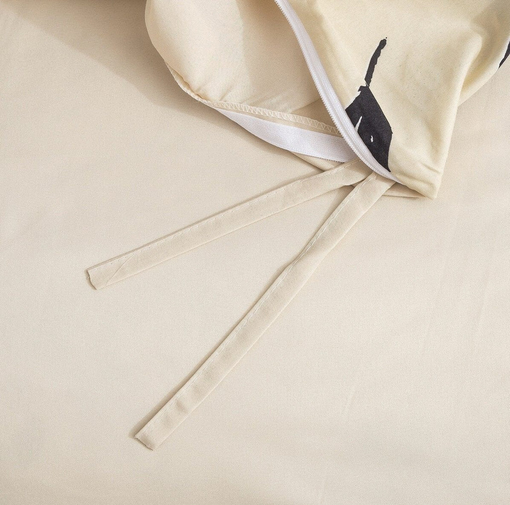 Cream duvet cover corner with fabric tie straps and zipper edge detail