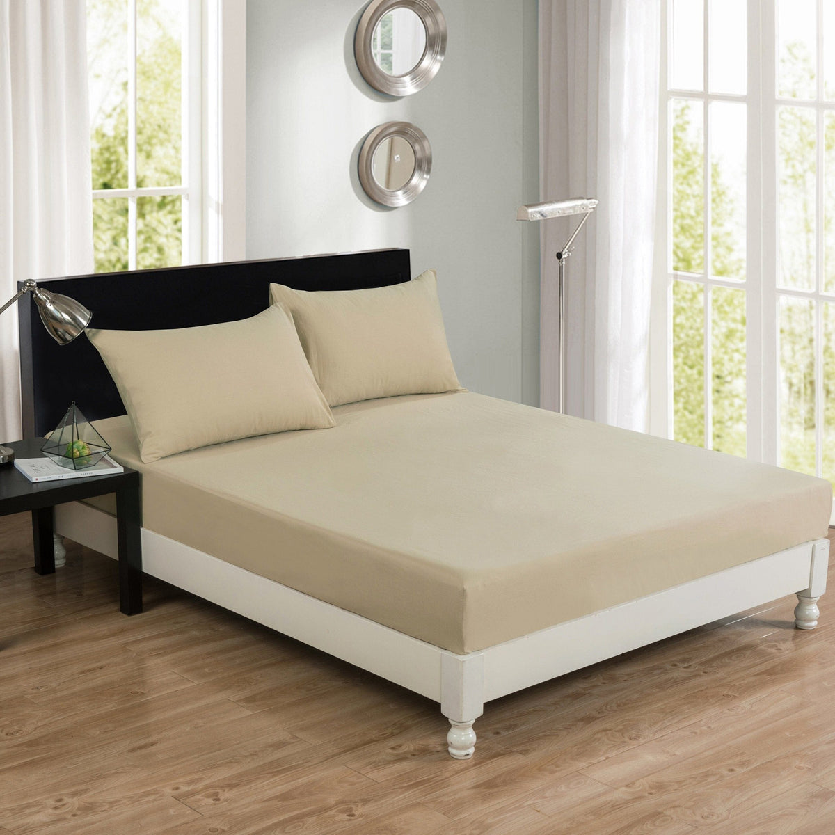 Olive-brown solid bed sheet with beige top and paisley-patterned accent pillows
