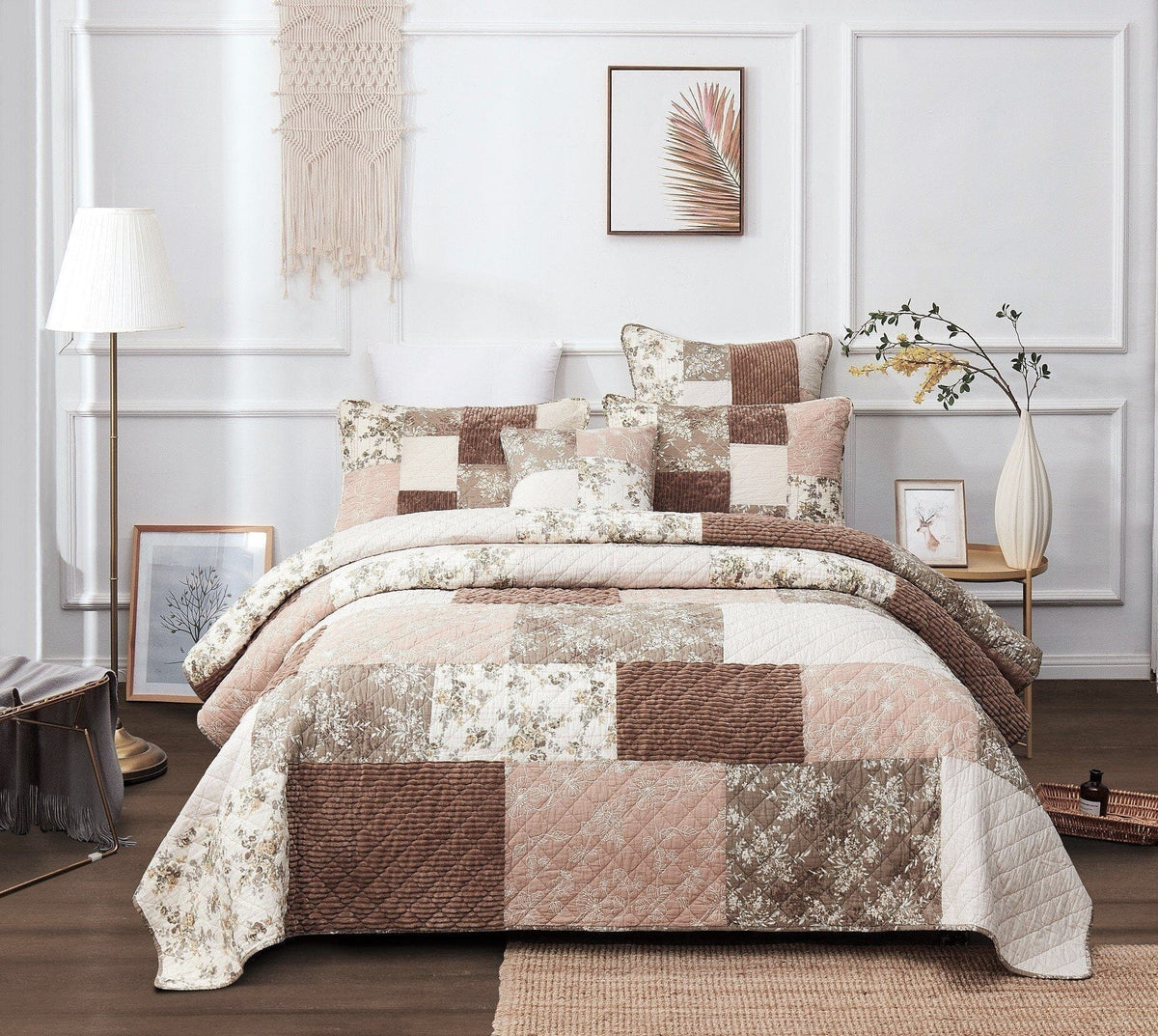 Patchwork quilted bedspread with floral blocks in dusty rose, taupe, and beige