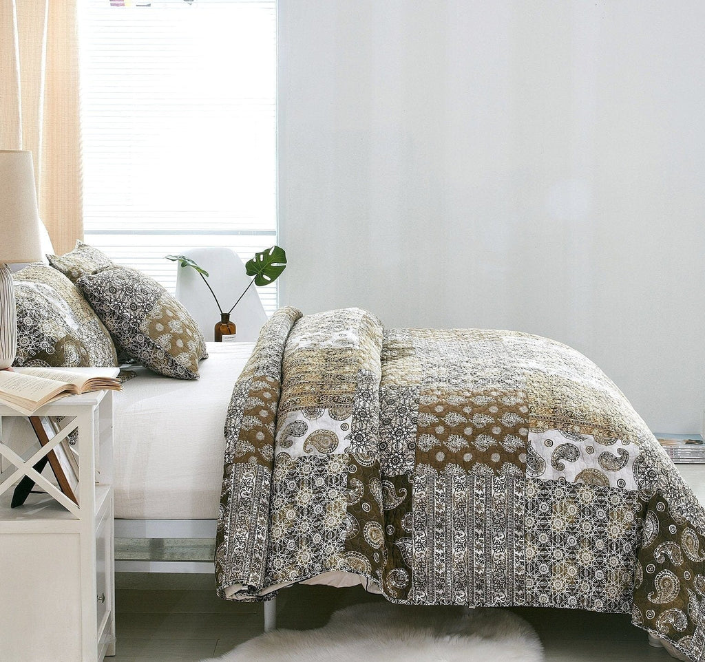 Olive-brown paisley bed set with patchwork bedspread and decorative throw pillow