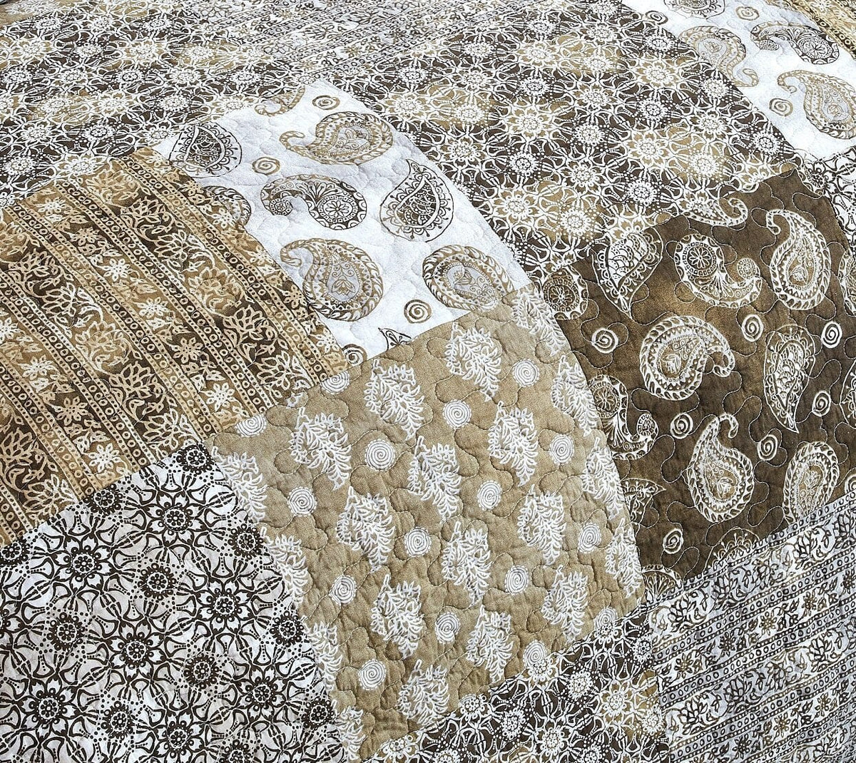Paisley floral bedding fabric in olive-brown, tan, and white with detailed motifs
