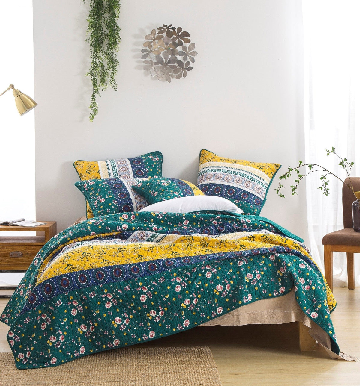 Patchwork quilt set with teal floral and yellow accents, decorative pieced pattern