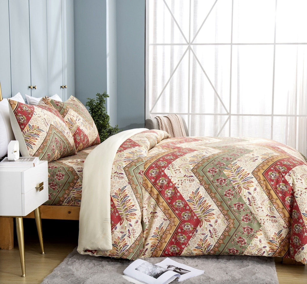 Floral chevron duvet cover with botanical print, red sage and beige on bed