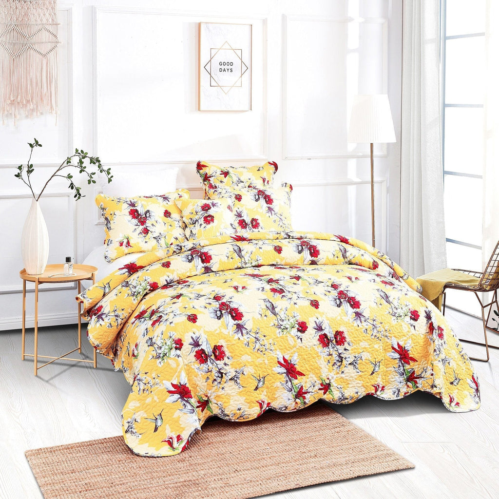 Yellow floral bed in a bag set with comforter and two matching pillow shams on a bed