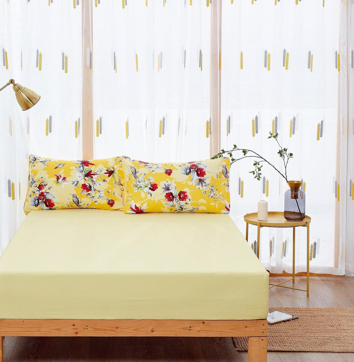 Yellow fitted bed sheet with two hummingbird floral pillowcases