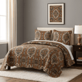 Quilted bedspread with earthy medallion pattern and scalloped edges; includes matching shams