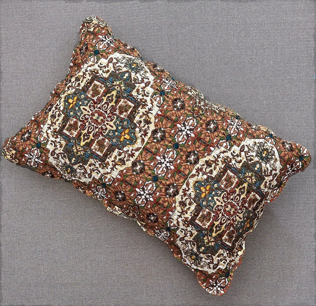 Quilted decorative pillow sham with ornate folk medallion pattern and textured edge