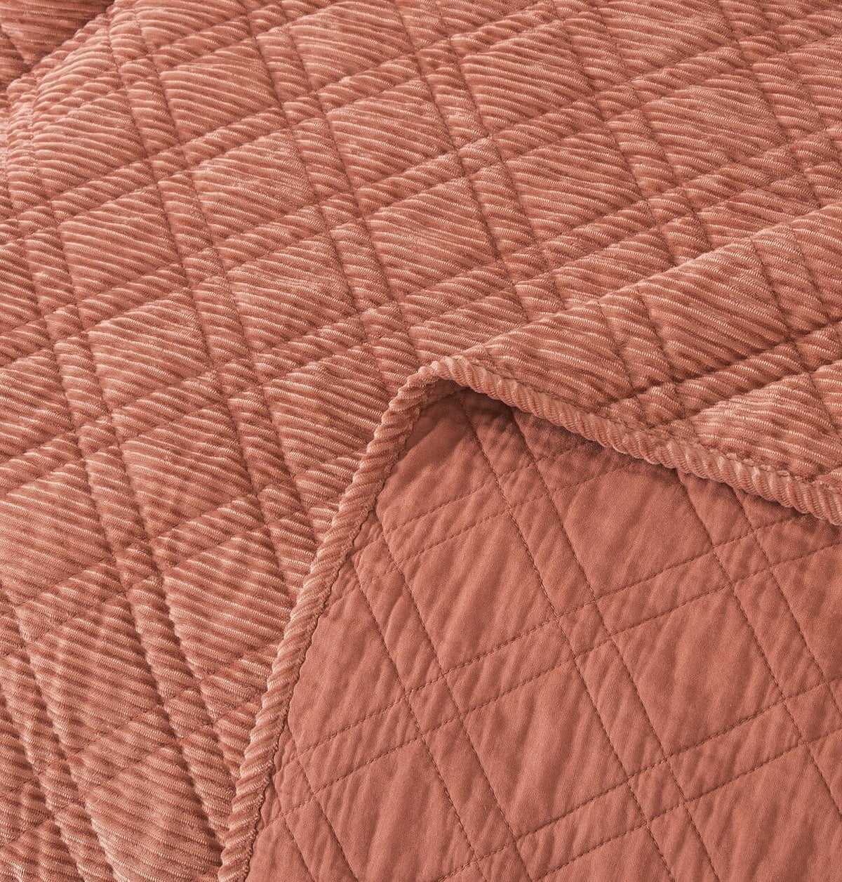 Terracotta coral quilted velour corduroy with stitched edge detail