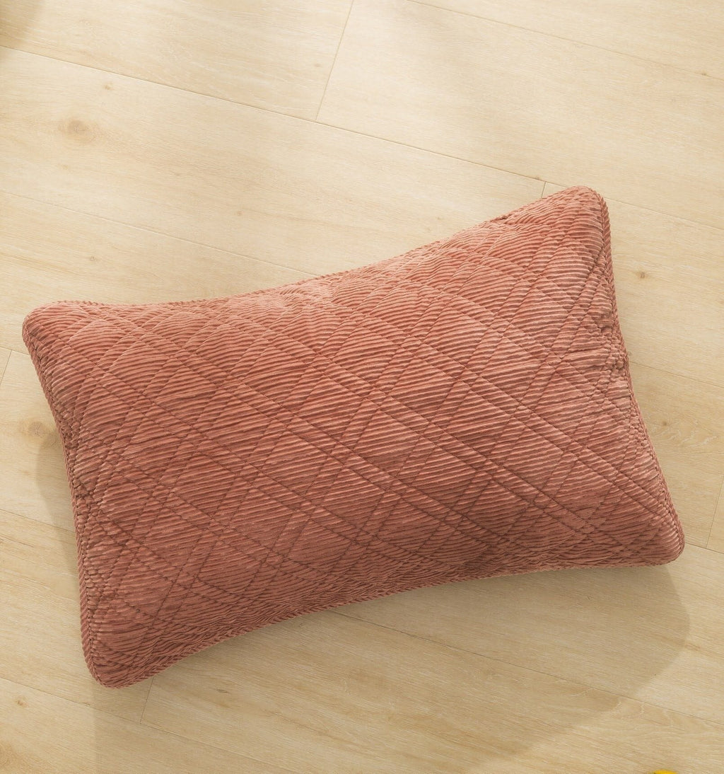 Terracotta coral velour corduroy decorative pillow with quilted diamond pattern