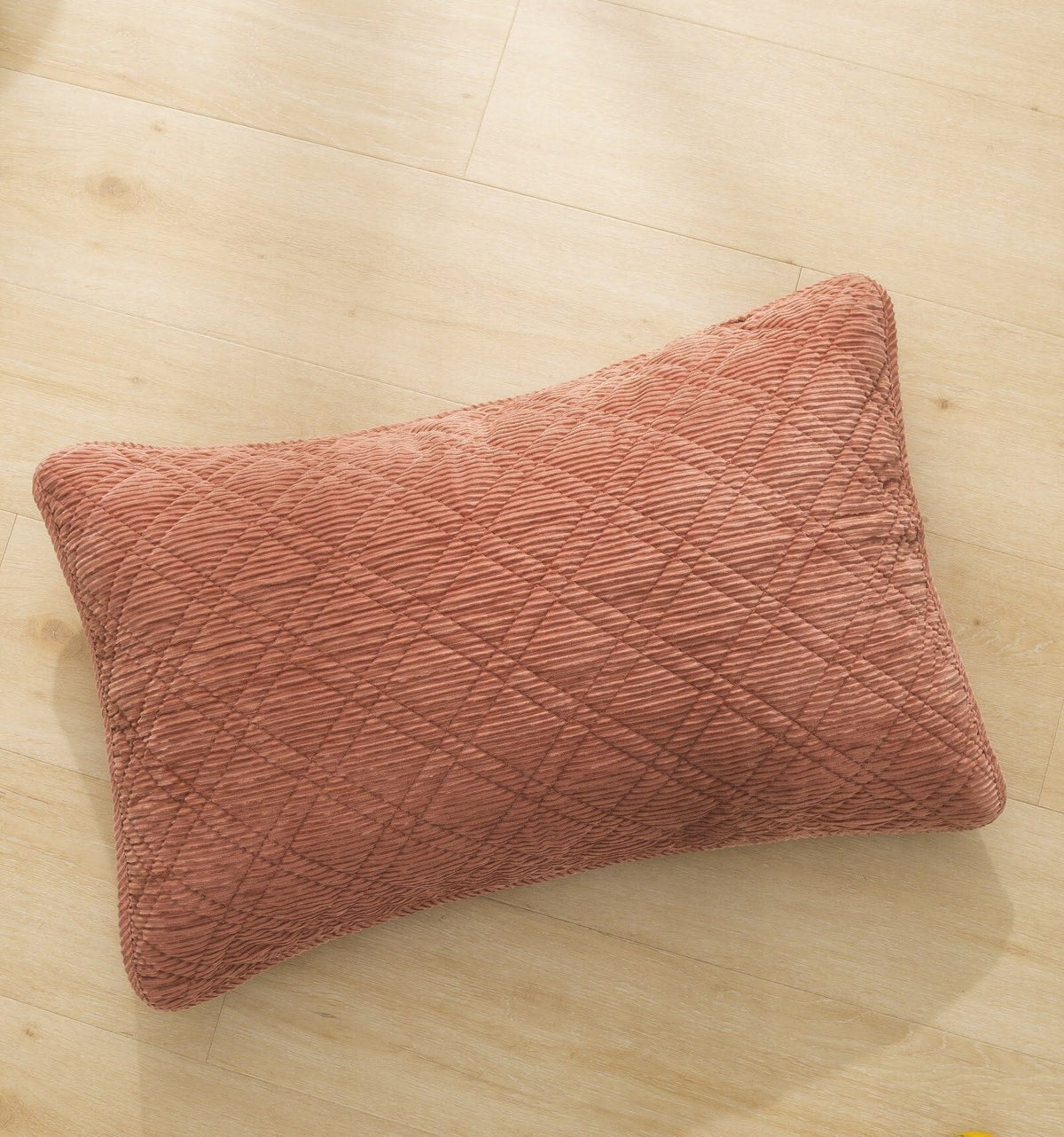 Terracotta coral velour corduroy decorative pillow with quilted diamond pattern