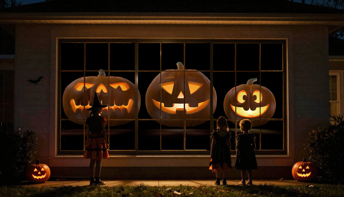 Jack-o-lantern projection on house window, with glowing pumpkin faces.