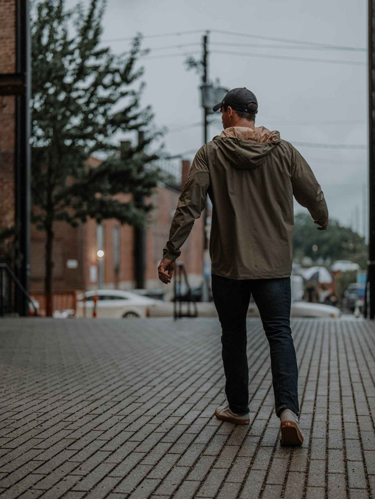 Men's olive hooded jacket, rear view with full-zip and shaped hood