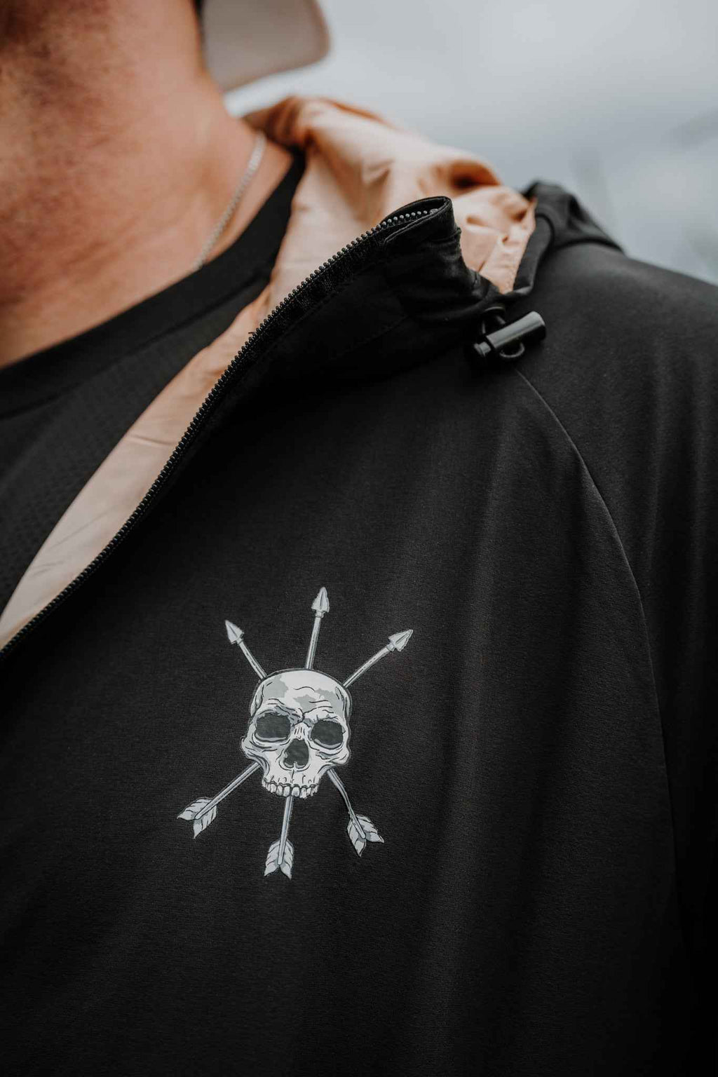 Black jacket chest logo with full-zip and hood opening