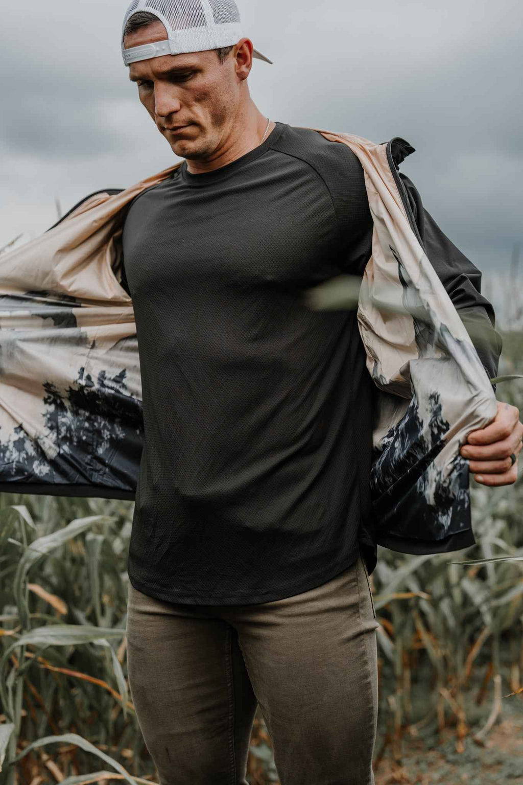 Man wearing black Journey jacket with hood and full zipper