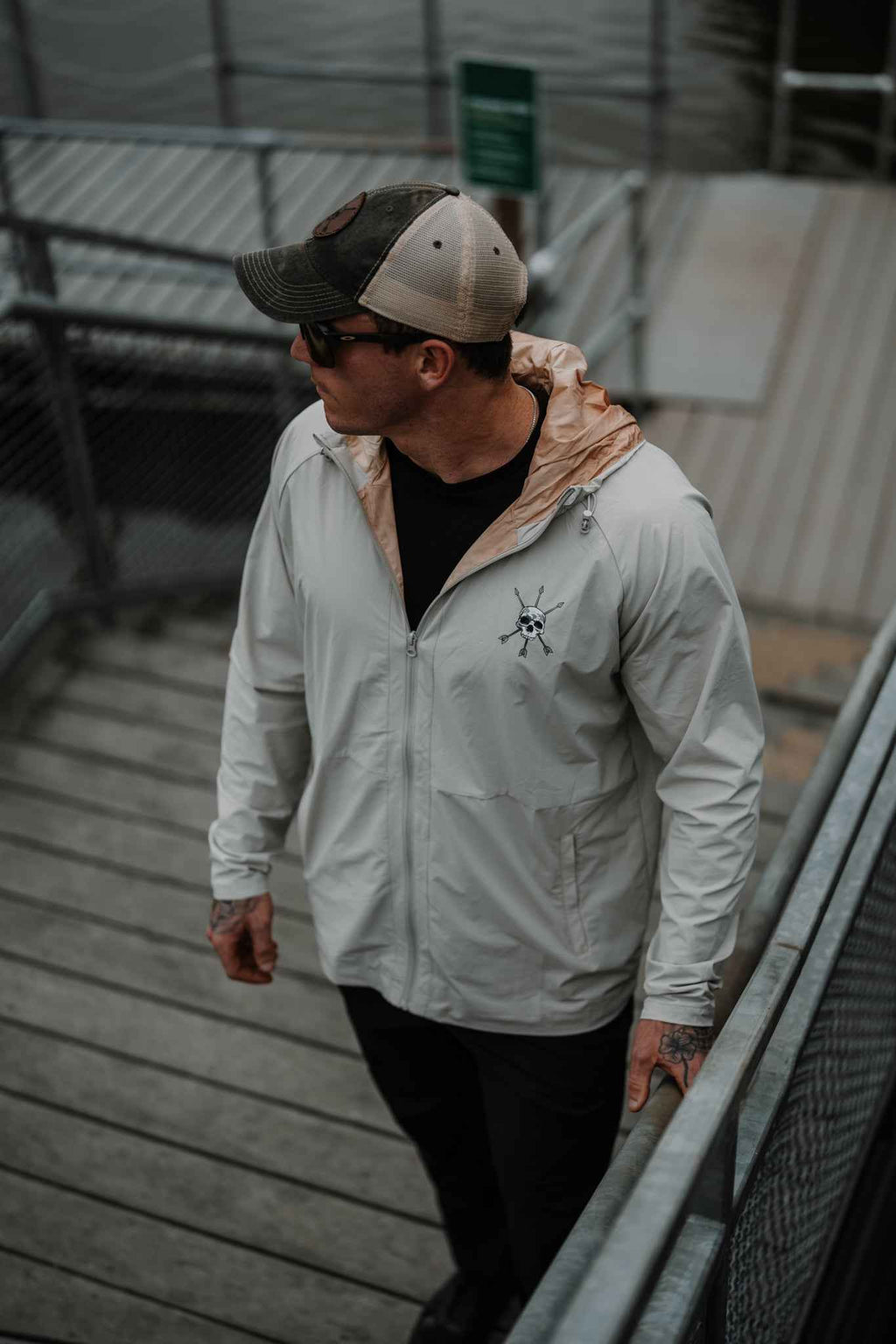 Men's Journey Jacket light gray with hood and front emblem, casual street view