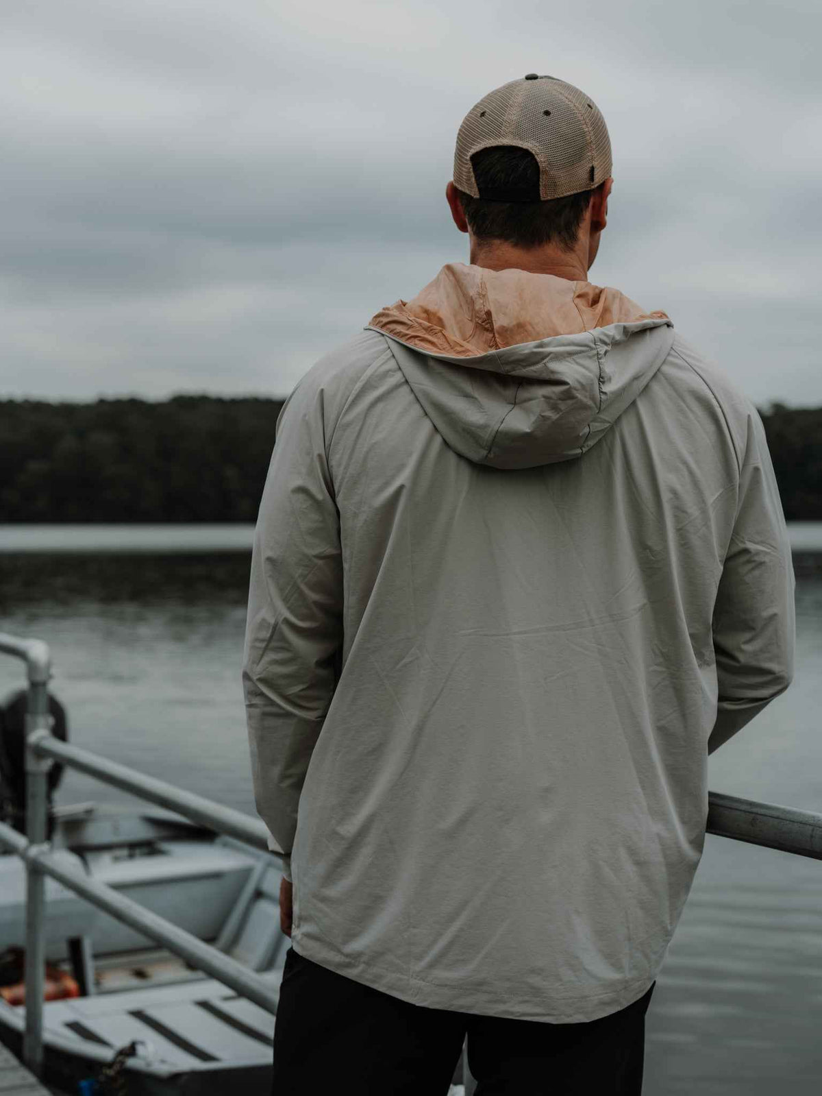 Men's Journey Jacket light gray worn from back; attached hood and full-zip front