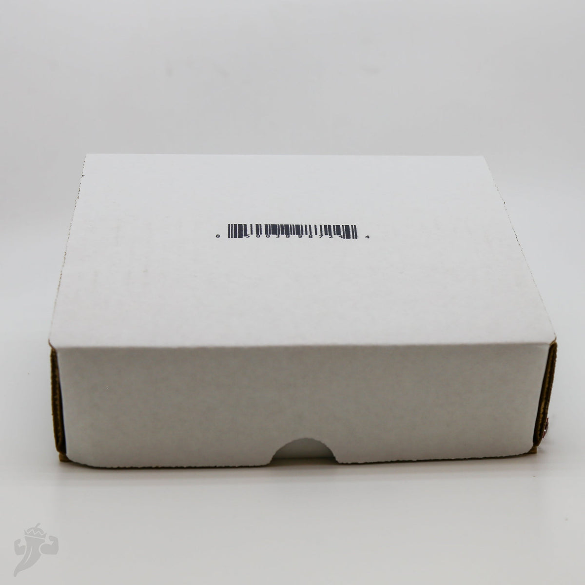 Closed white BBQ spice gift pack box with barcode sticker on top panel