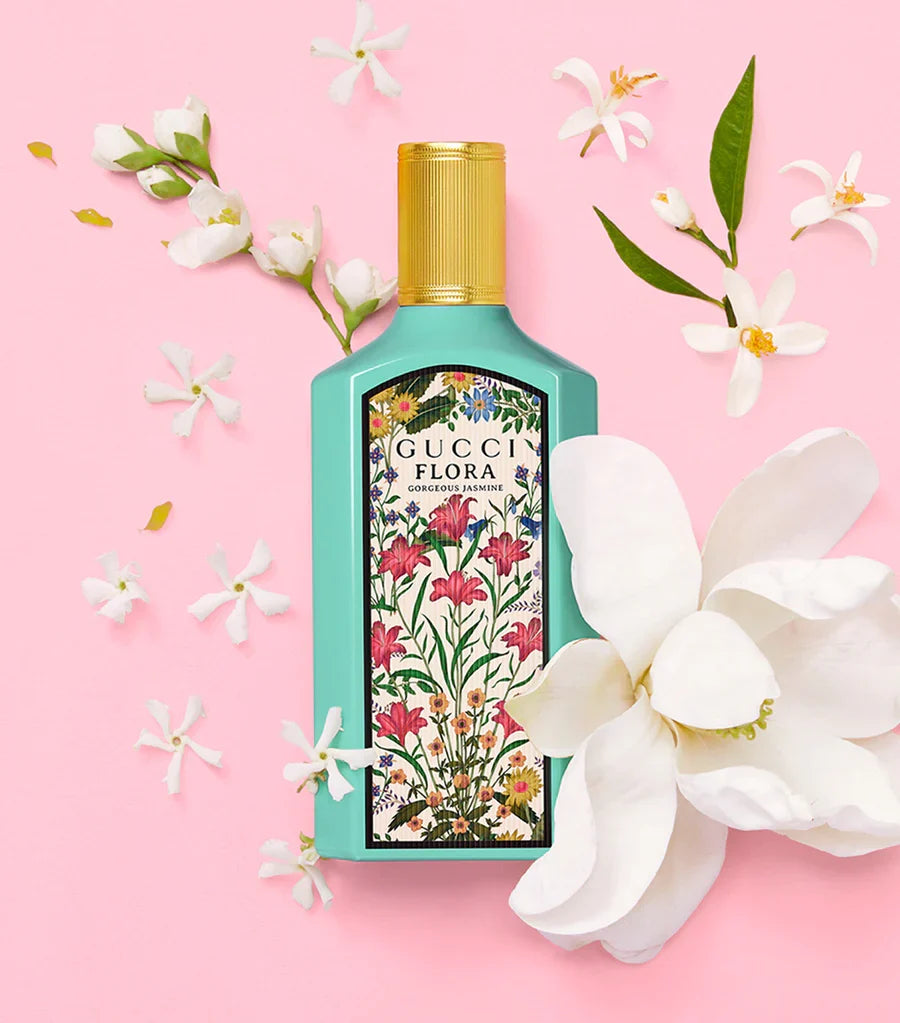Gucci Flora Gorgeous Jasmine eau de parfum bottle with gold cap and white orchids