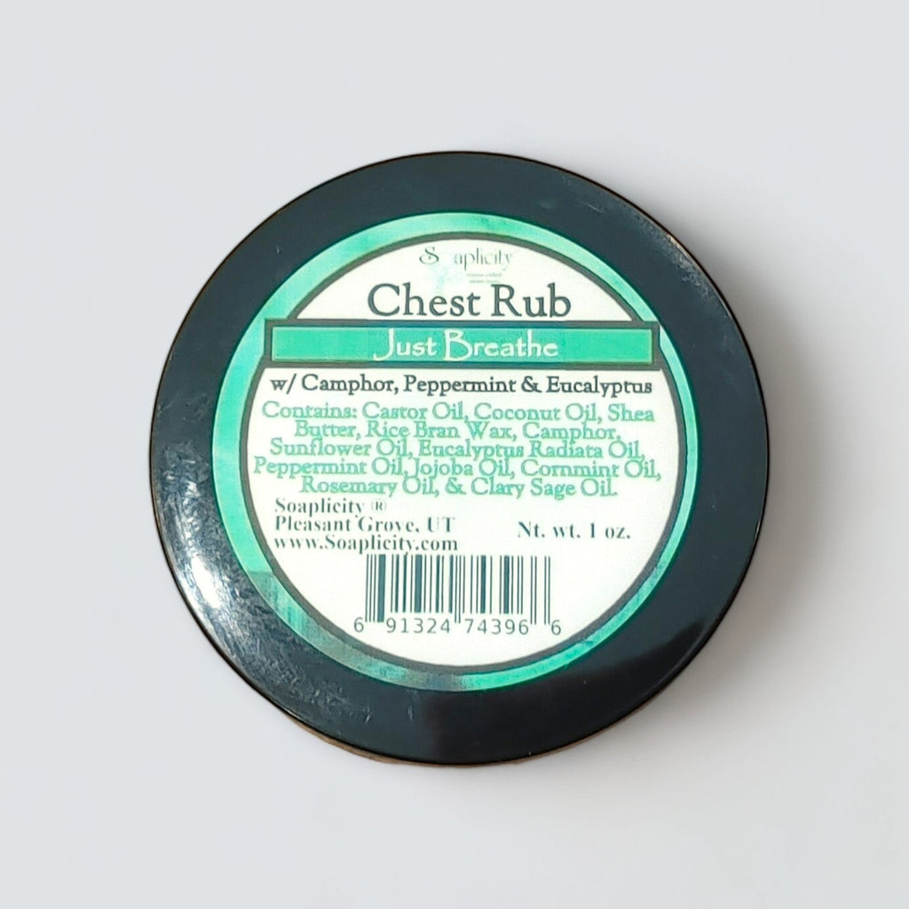 Chest rub container with black lid and green label, round top view