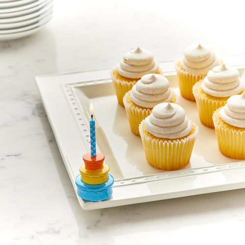 Bluebird mini ceramic bird on a tray next to cupcakes