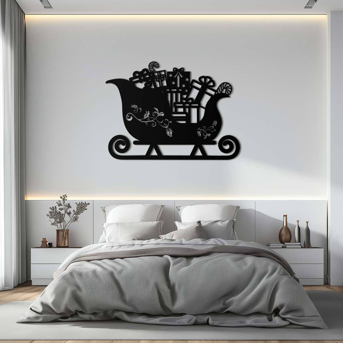 Black metal sleigh wall art with gift motif and ornate spiral runner base