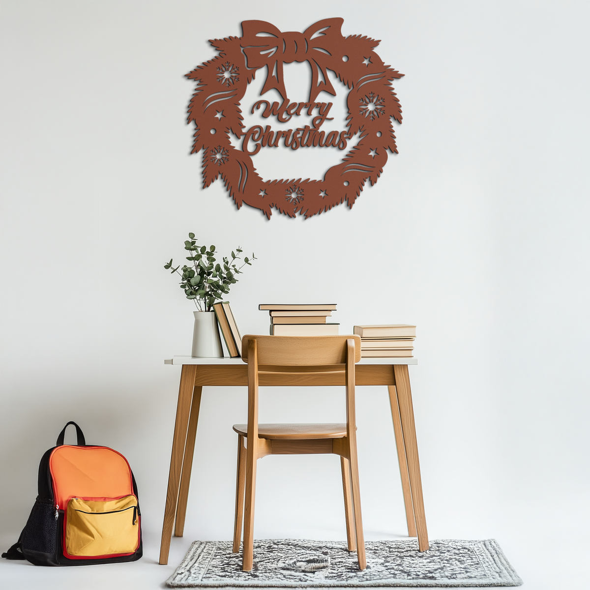 Brown metal Christmas wreath wall art with bow and 'Merry Christmas' text
