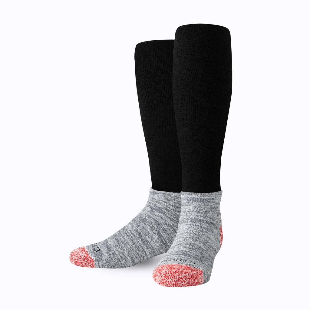 CozyGrip compression slipper socks set: two black legs with gray foot and red grip toe