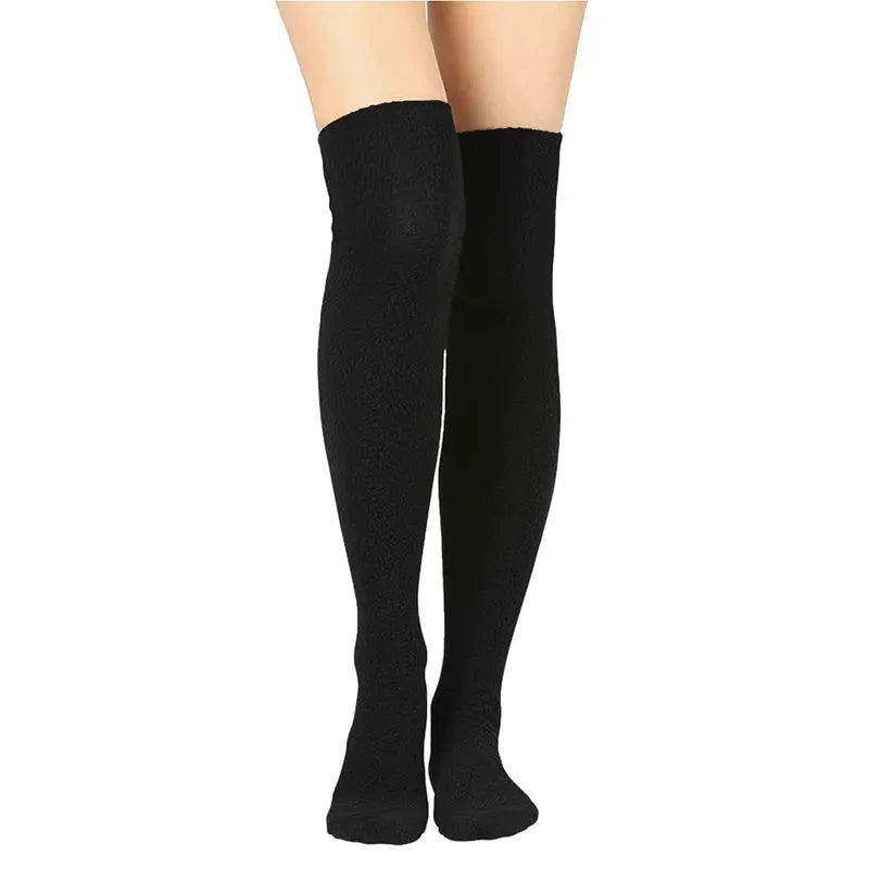 Over-the-knee fleece socks in black knit, worn on legs with long coverage.