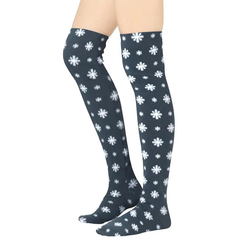 Over-the-knee fleece socks, dark base with scattered white snowflakes