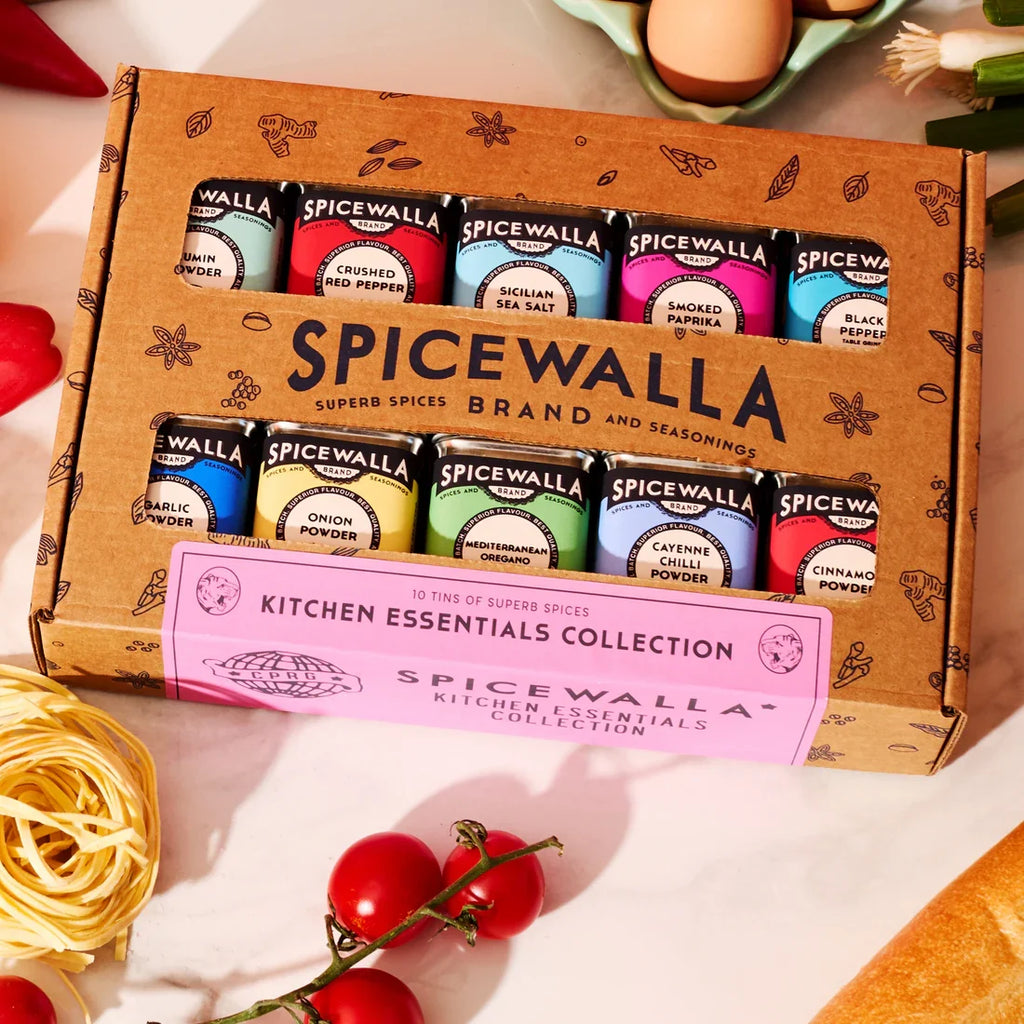 Spice container gift set with SpiceWalla tins in a brown cardboard Kitchen Essentials box