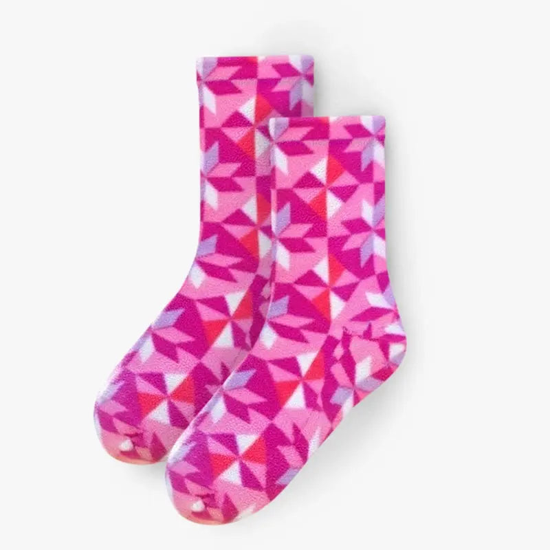 Pair of pink and white fleece crew socks with geometric triangle kaleidoscope print