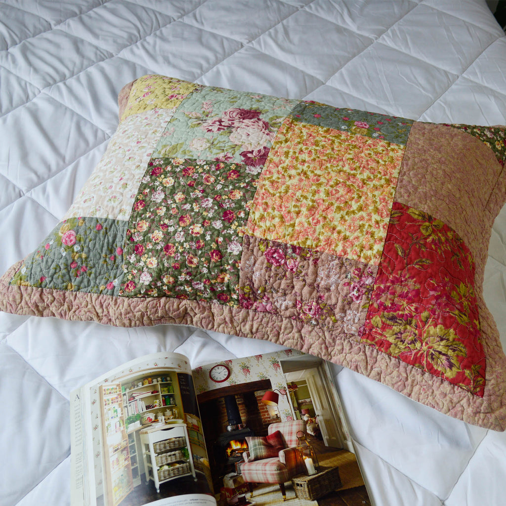Patchwork floral cotton pillow sham with ruffled quilted edge, yellow and red blocks