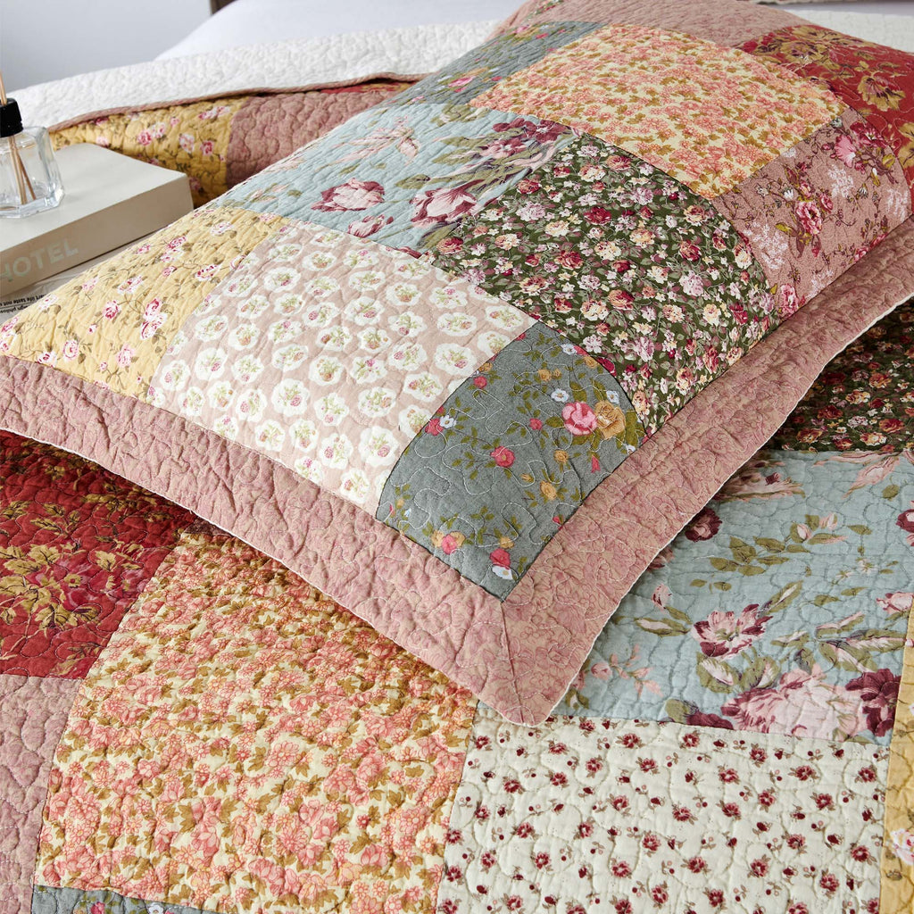 Quilted patchwork floral pillow shams with ruffled borders, multicolor fabric blocks