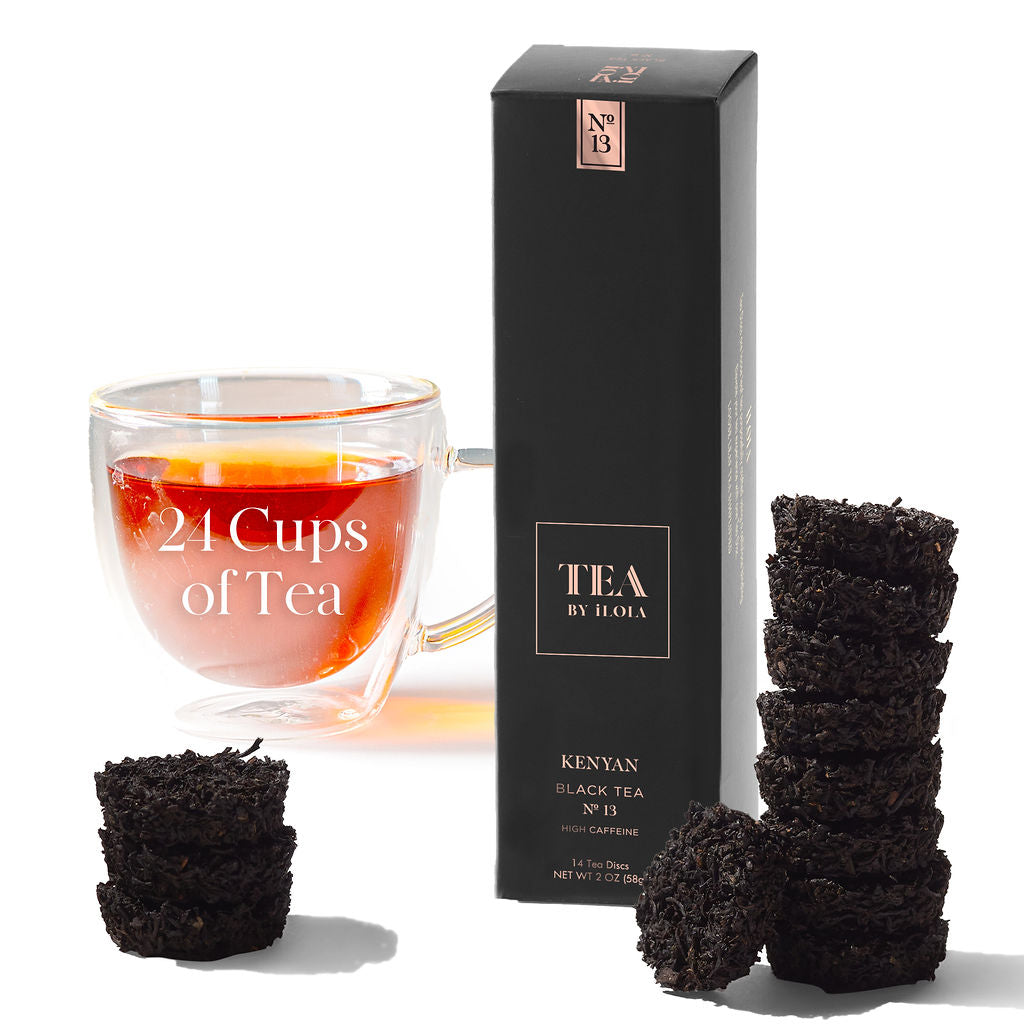 Kenyan No. 13 black tea box with a cup of tea and stacked tea discs