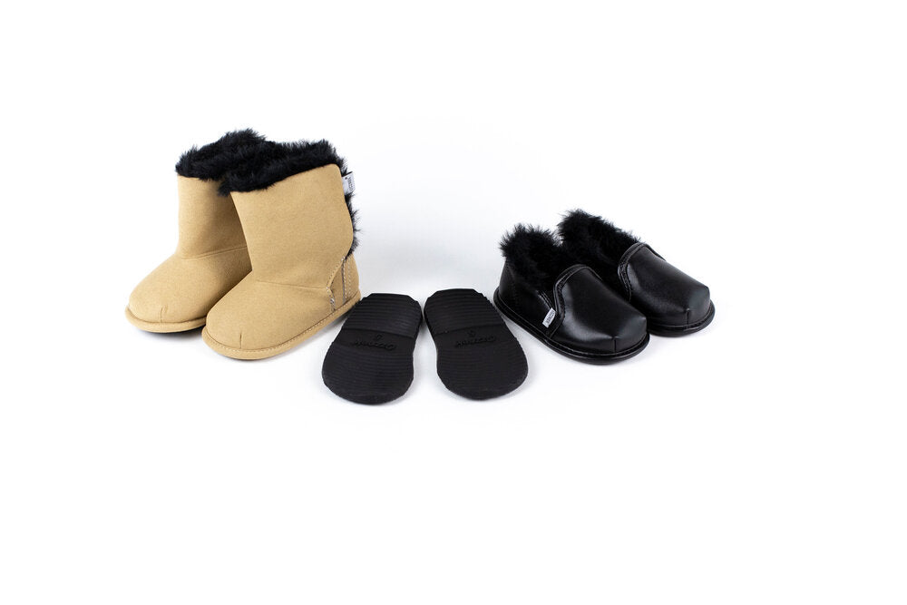 Kids’ tan and black slip-on boots with removable sole inserts