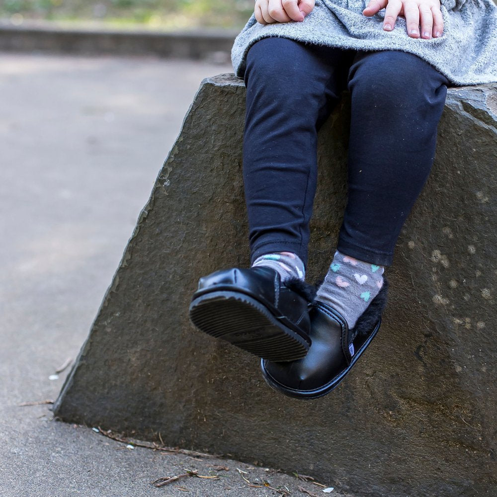 Kids’ black slip-on shoes with patterned socks