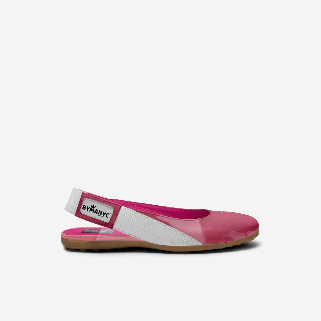 Kids' vegan ballerina flats in pink with white side panels and flat tan sole