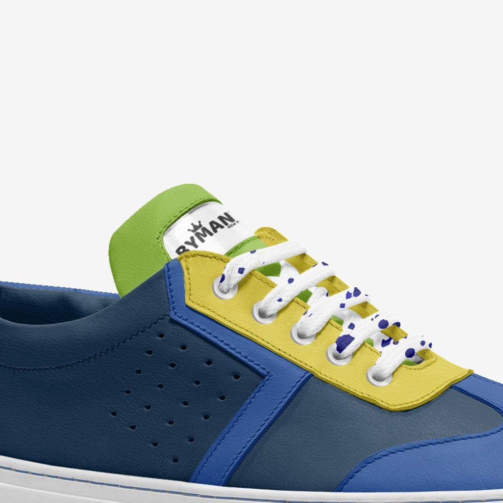 Navy blue sneaker with yellow lace panel, perforations, and white eyelet laces