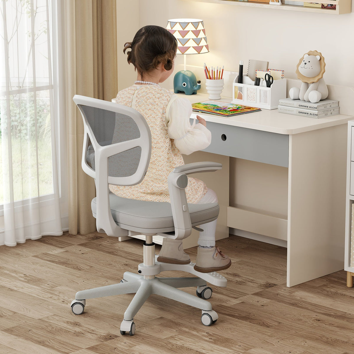 Kids desk chair with adjustable height, armrest, and footrest; light gray fabric seat.