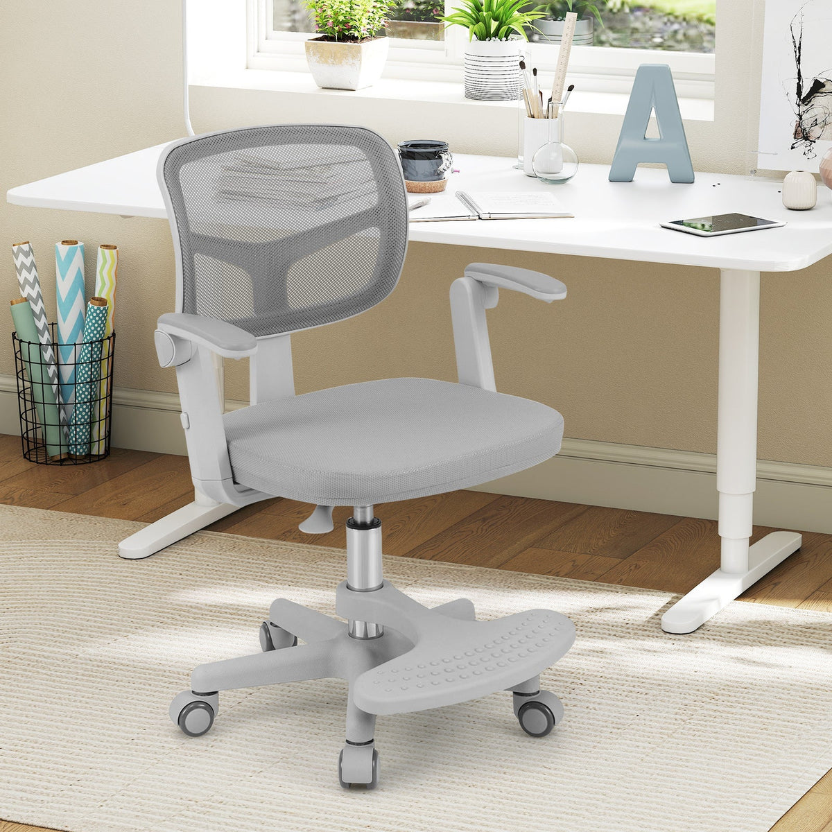 Kids desk chair with grey seat, grey mesh back, adjustable height footrest base