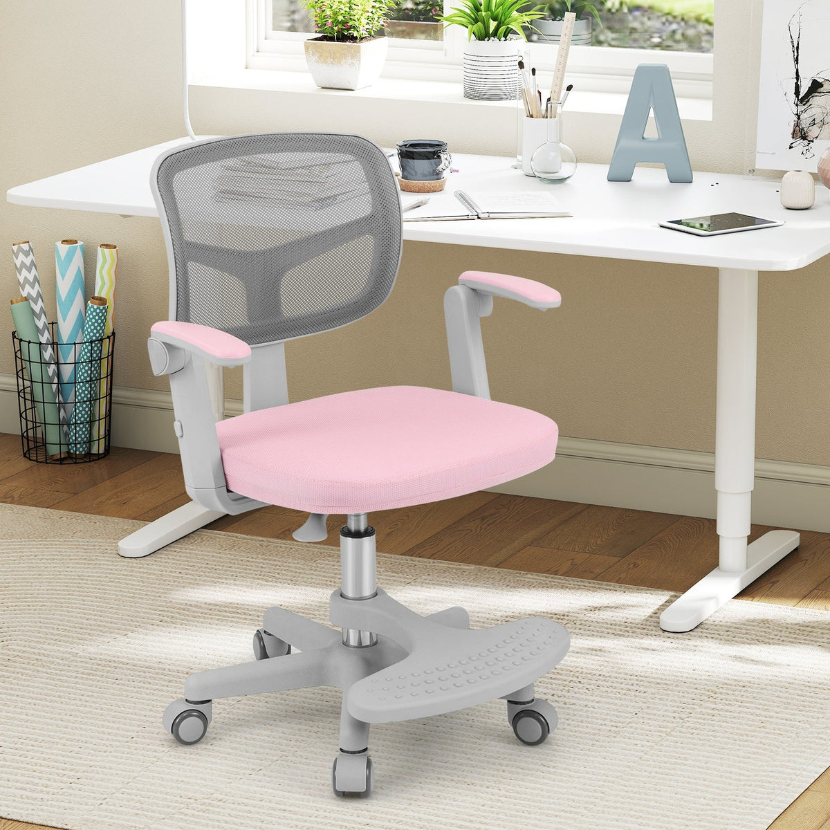 Kids desk chair with pink seat, grey mesh back, adjustable height footrest base