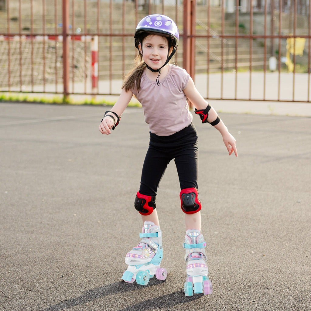 Kids adjustable quad roller skates in light blue and silver with glowing wheels