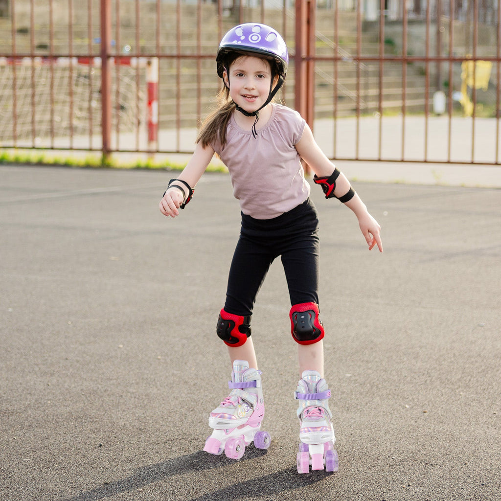 Kids adjustable quad roller skates in light pink and purple with glowing wheels