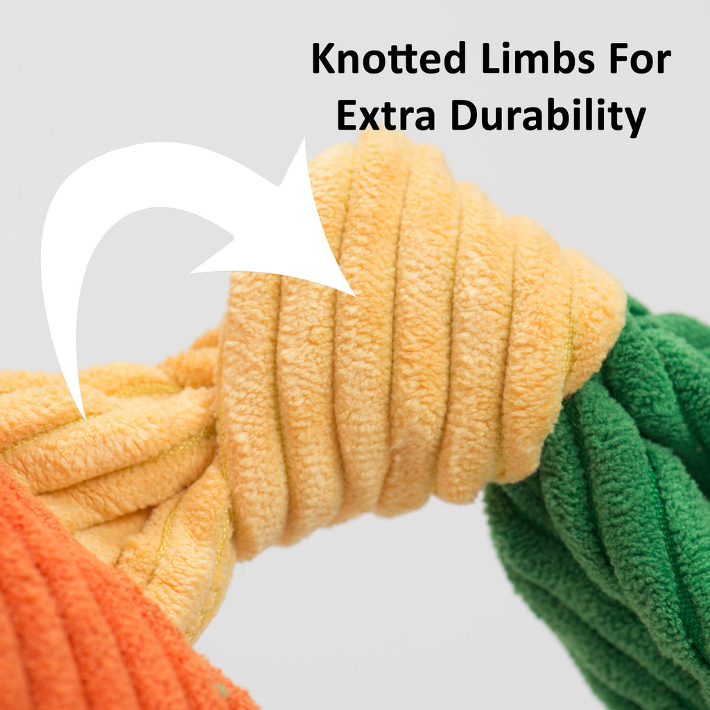 Knotted plush dog toy limbs in orange and green fleece close-up