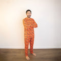 Orange crew-neck long-sleeve pajama set with allover racing graphic print