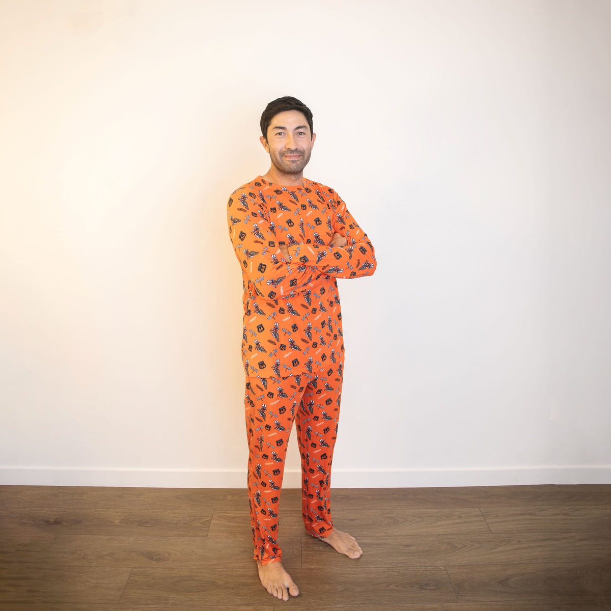 Orange crew-neck long-sleeve pajama set with allover racing graphic print