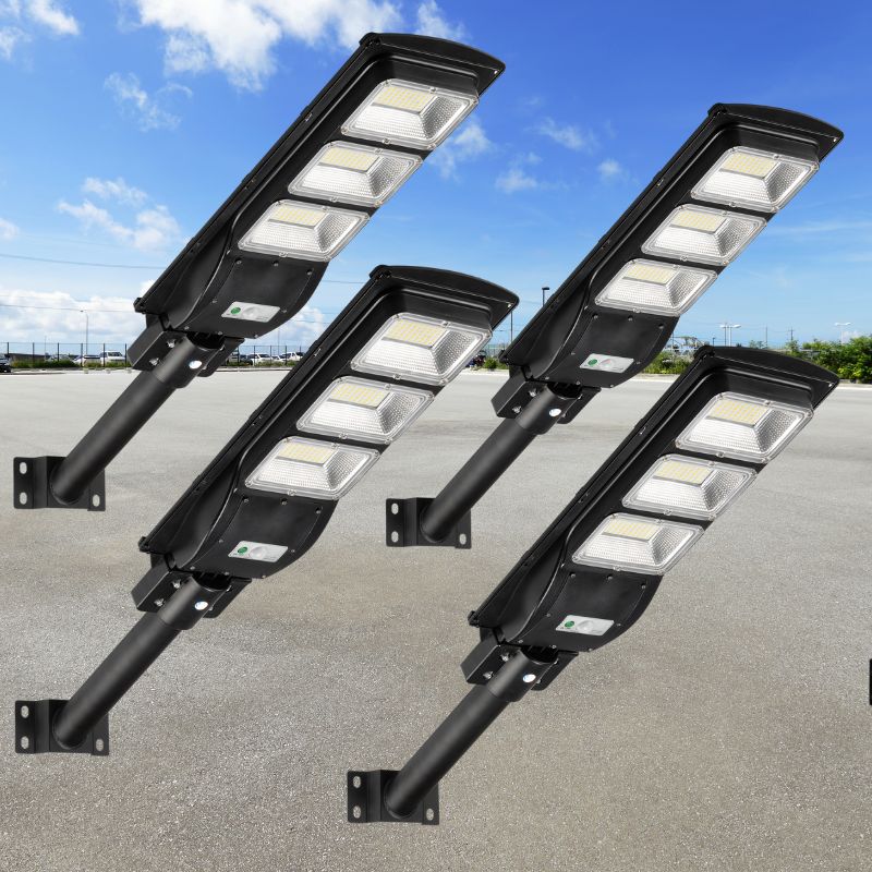 4-pack solar parking lot light with wall bracket, black housing, multiple LED panels