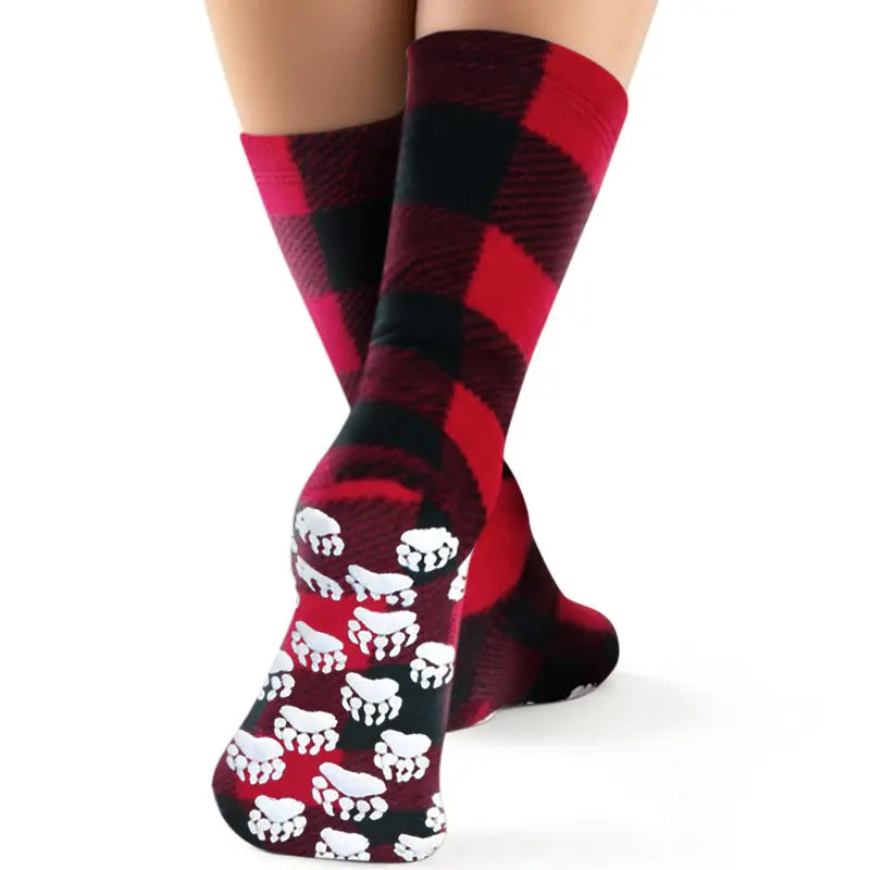 Kids' fleece socks with red-and-black plaid cuffs and white skull print on legs