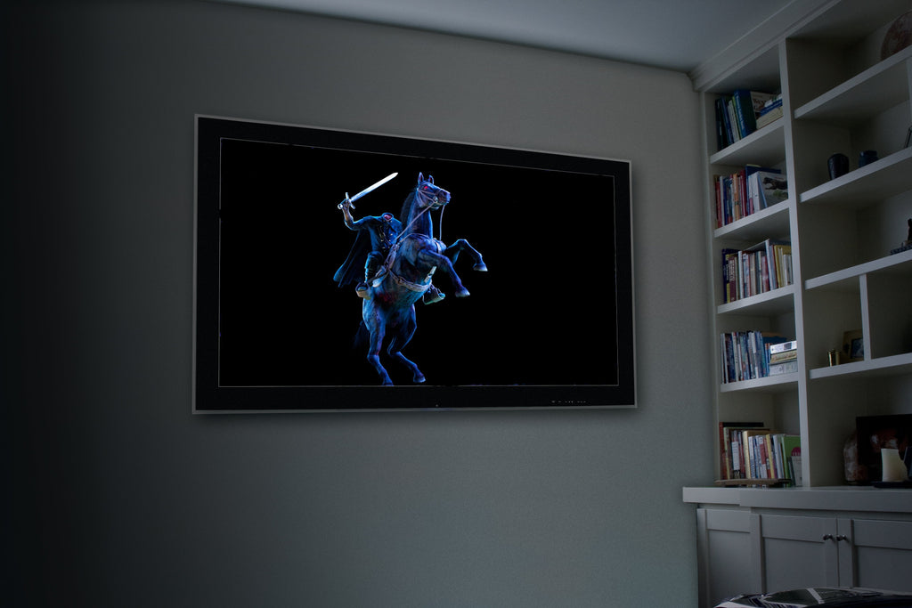 Blue dancing skeleton projection on wall-mounted black display frame