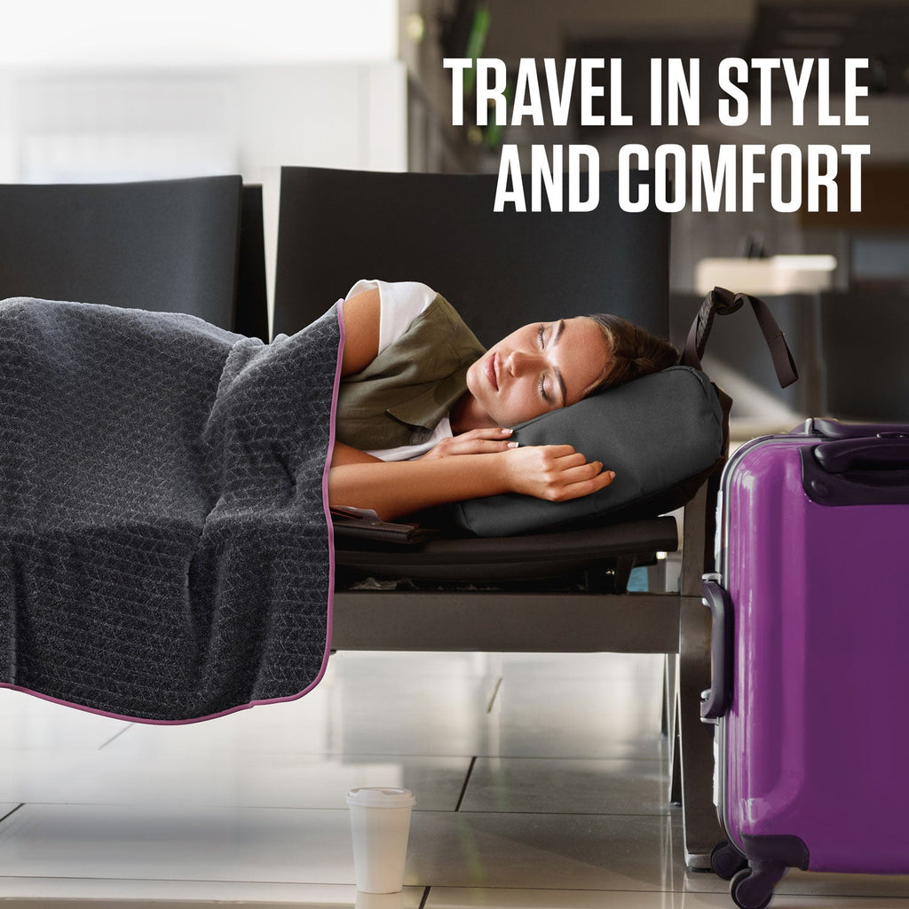 Gray quilted travel blanket draped for comfort with matching pillow case
